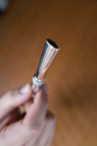 Bombilla de plata y oro